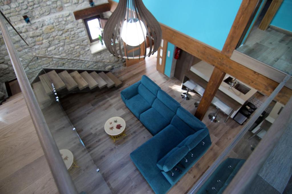 an overhead view of a living room with a blue couch at Gaubeako Ekhia in Espejo