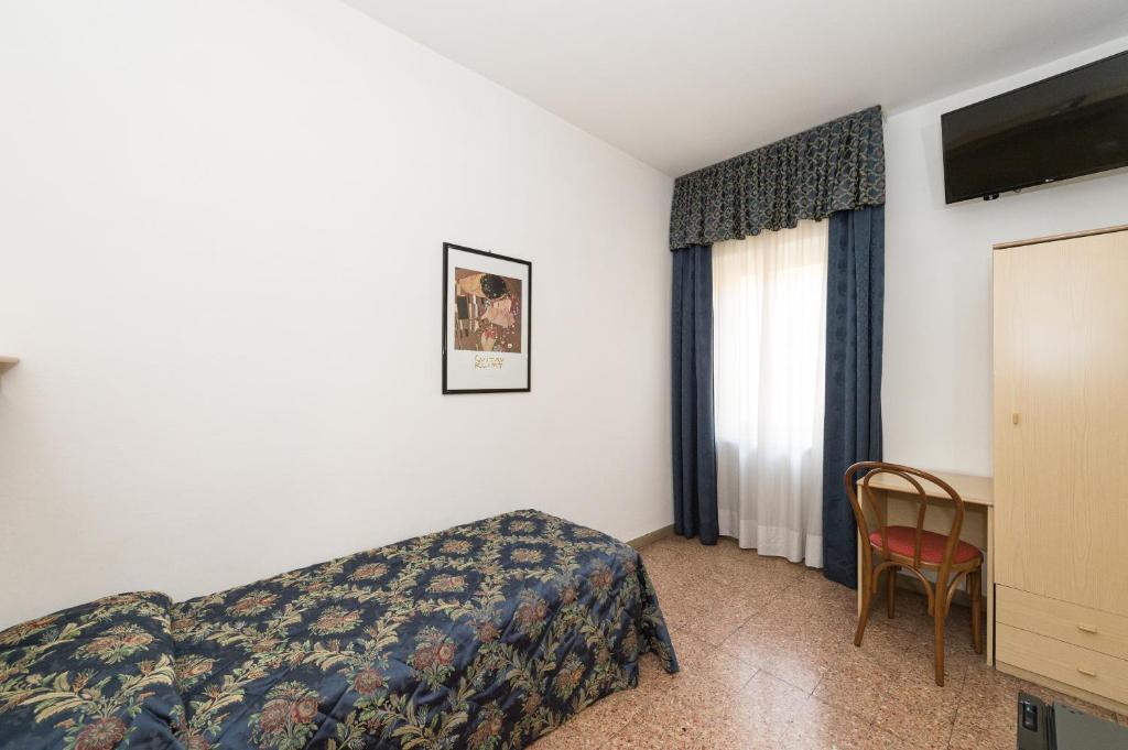 Postel nebo postele na pokoji v ubytování Hotel Primo
