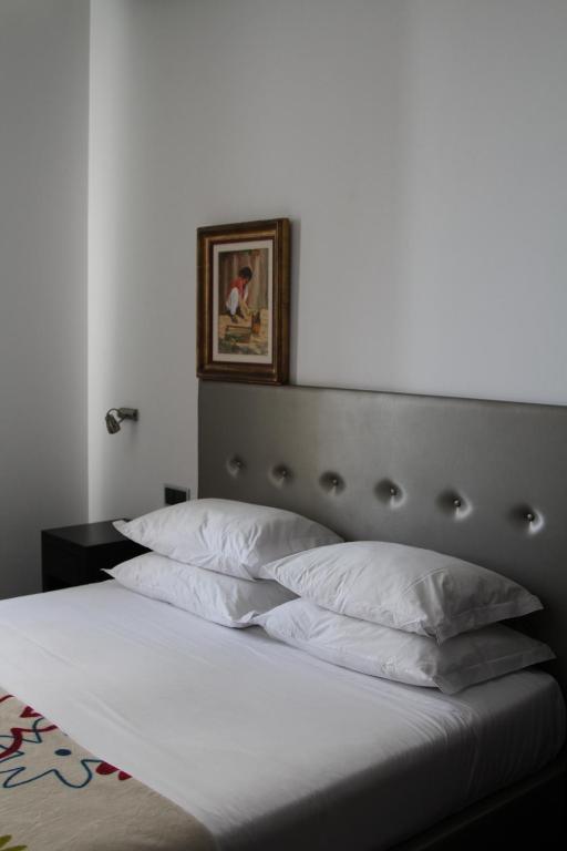 Postel nebo postele na pokoji v ubytování Lazza Hotel