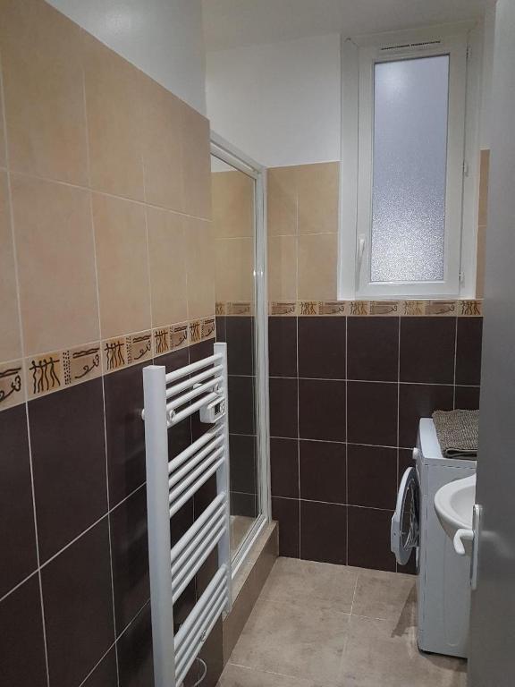 a bathroom with a shower and a toilet and a sink at le mauritania in Sainte-Maxime