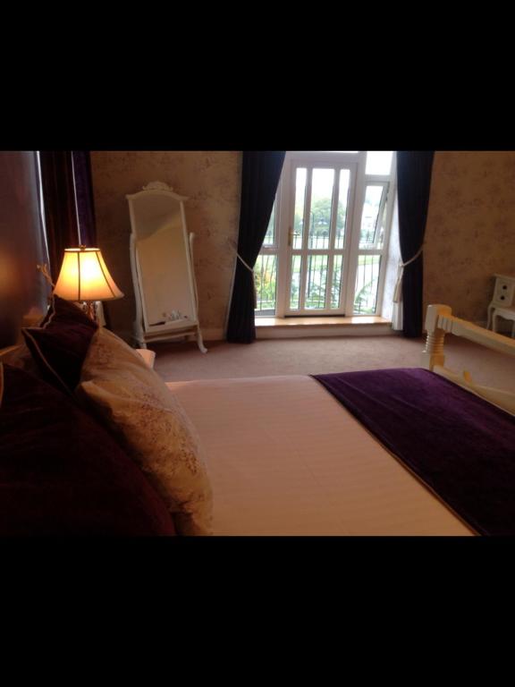 Postel nebo postele na pokoji v ubytování Woodlands Hotel & Leisure Centre