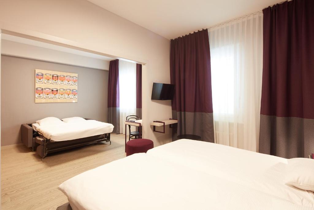Postel nebo postele na pokoji v ubytování Hôtel Crystal