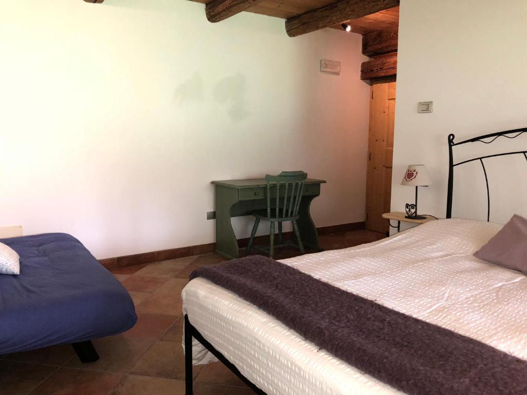 Posteľ alebo postele v izbe v ubytovaní B&B Maso Zont Antico Maso