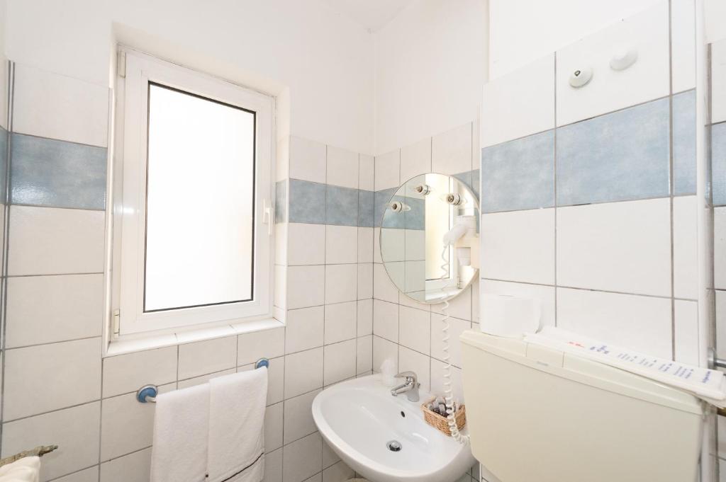 Koupelna v ubytování Hotel Primo