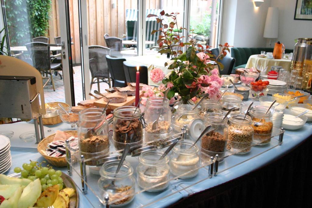 a long table with a bunch of food on it at Gasthof Oldenwöhrden in Wöhrden