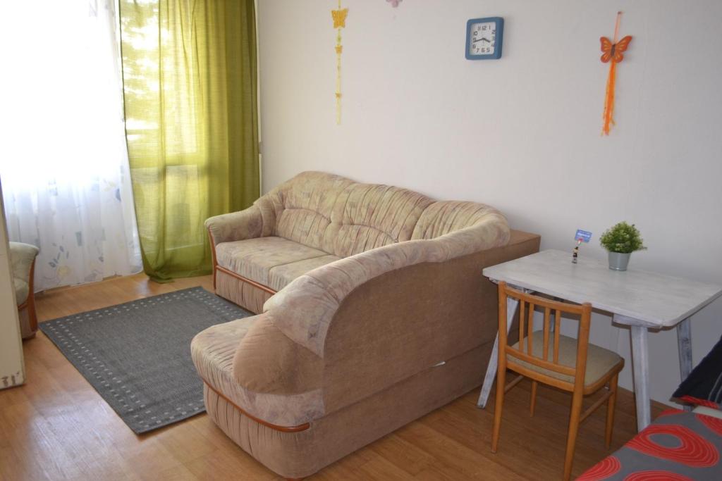 a living room with a couch and a table at Apartment in the City Centr in Teplice
