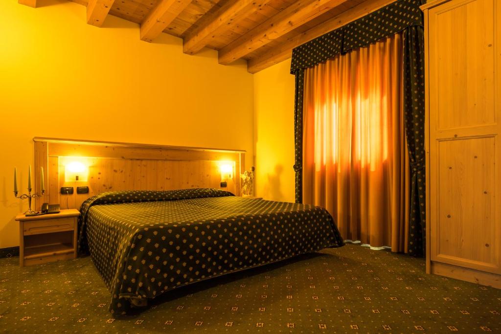 Postel nebo postele na pokoji v ubytování Hotel Dall'Ongaro