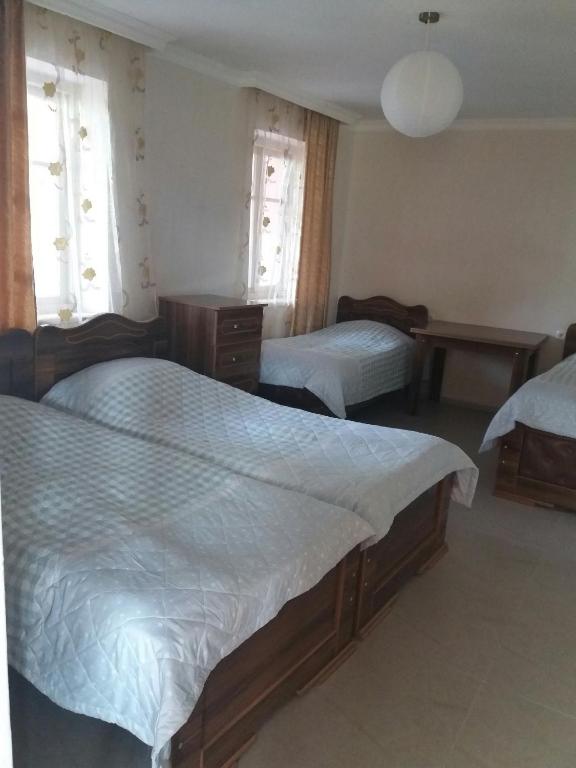 Postel nebo postele na pokoji v ubytování Guest house Racha