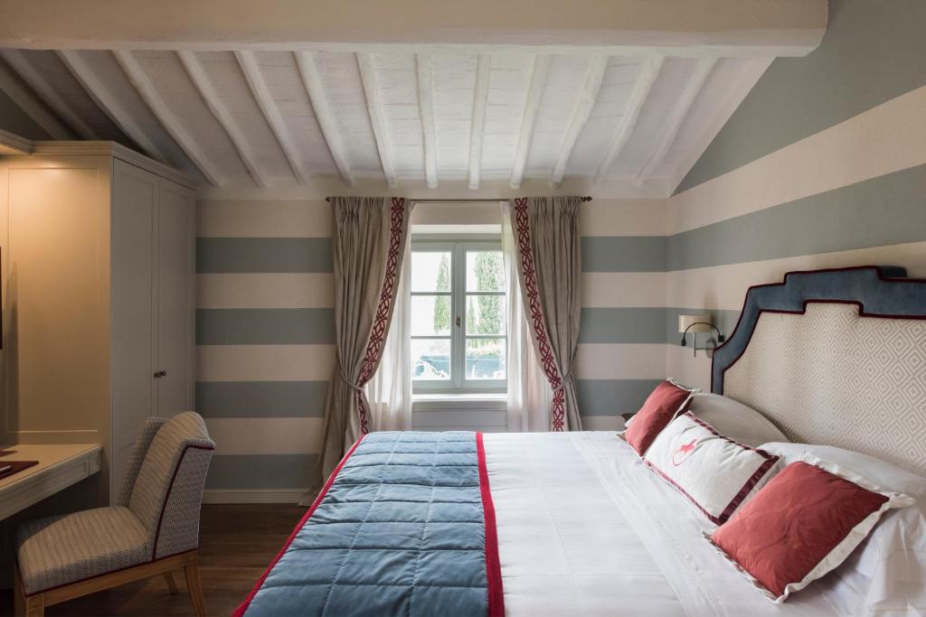 Postel nebo postele na pokoji v ubytování Borgo San Felice Resort