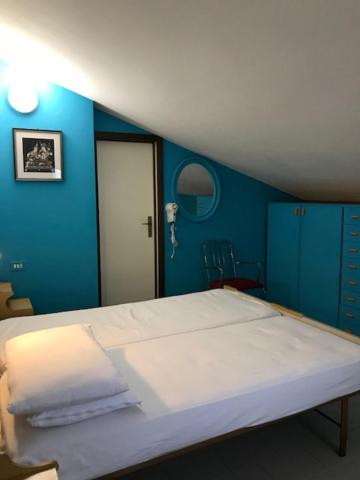 Postel nebo postele na pokoji v ubytování Hotel MIRO'