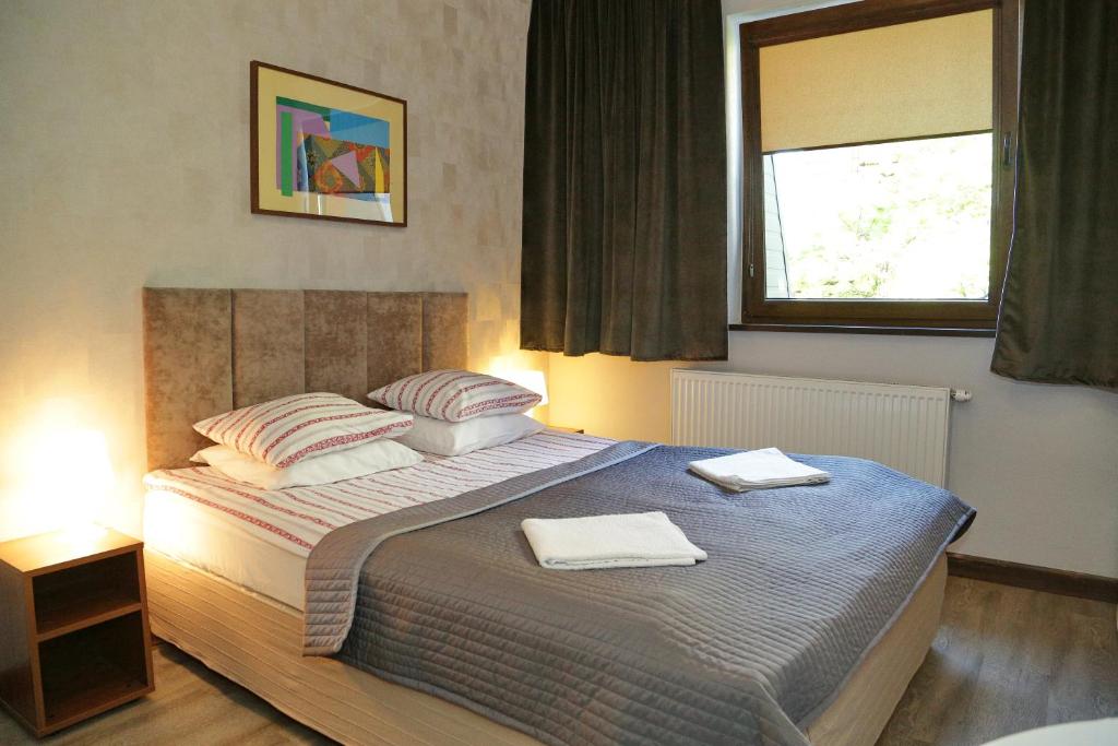 Posteľ alebo postele v izbe v ubytovaní B & B Tomula