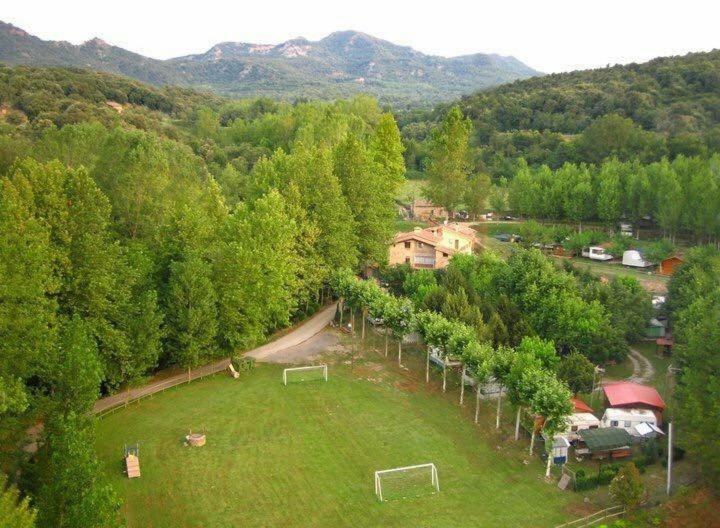 an aerial view of a field with a soccer ball at Càmping Molí de Vilamala in Les Planes d'Hostoles