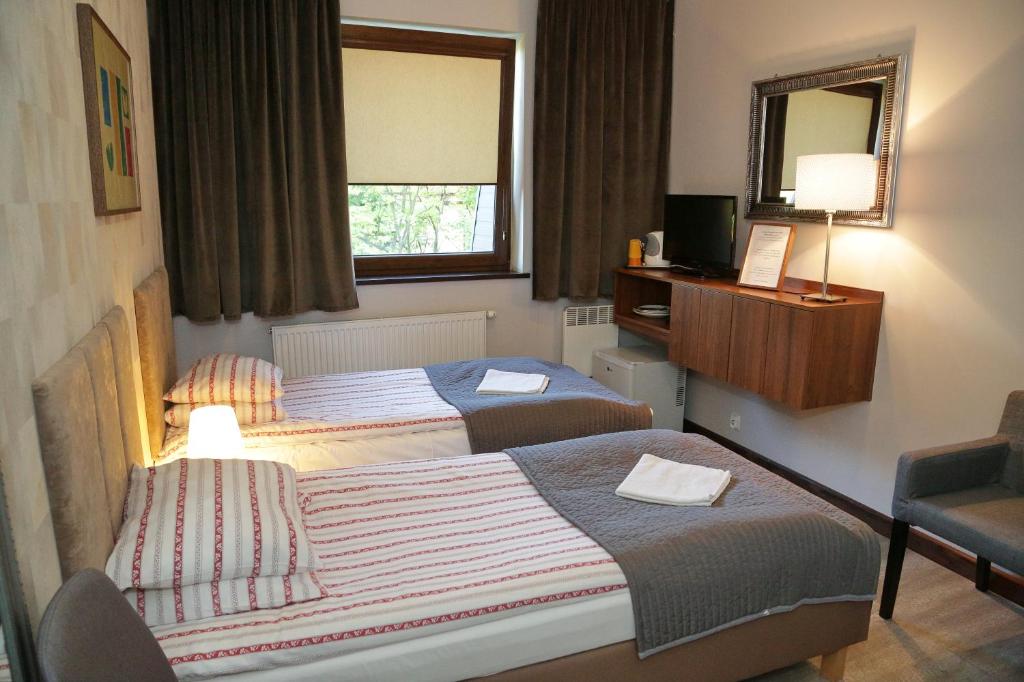 Posteľ alebo postele v izbe v ubytovaní B & B Tomula