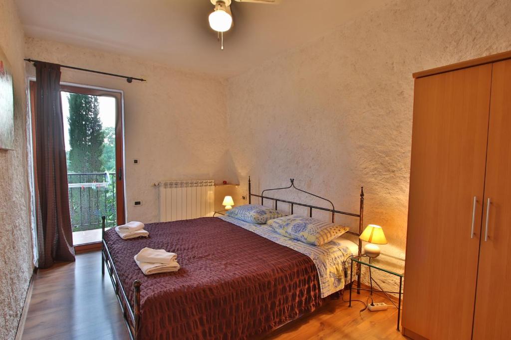 Postel nebo postele na pokoji v ubytování Rooms and Apartment Feral