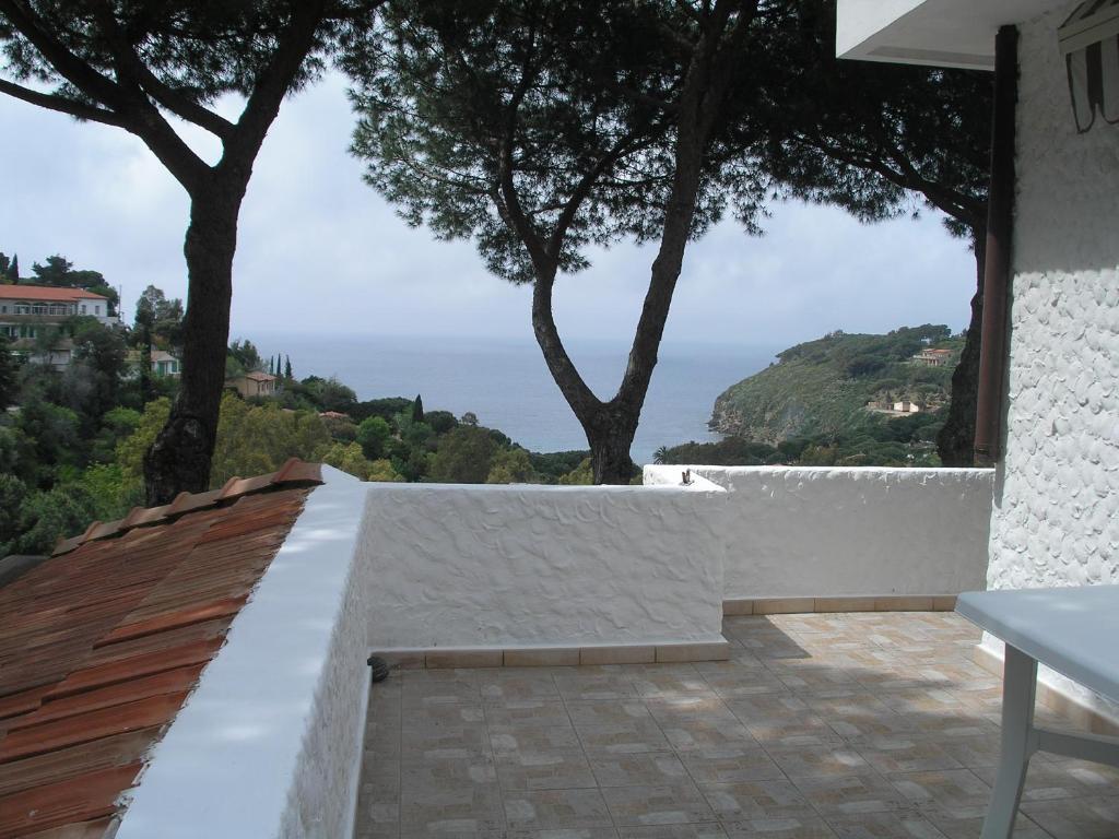 a view of the ocean from a house at Residence I Pini in Capoliveri