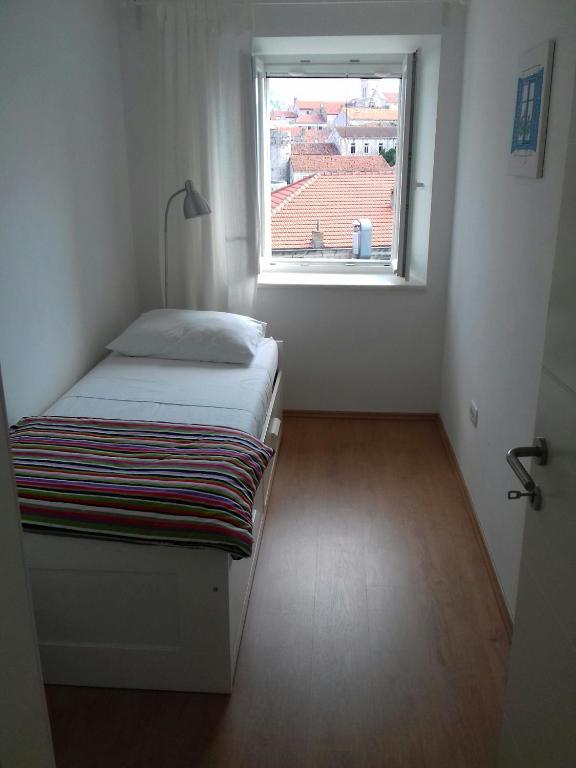 Posteľ alebo postele v izbe v ubytovaní Apartments An Ni