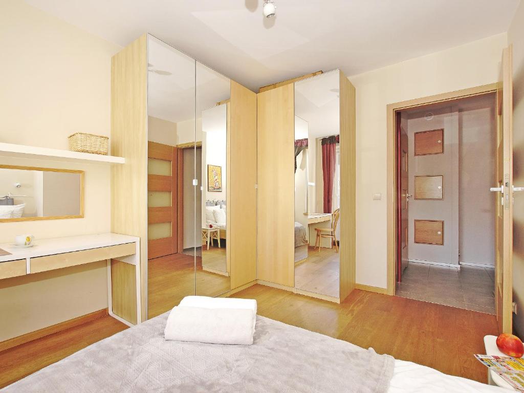 Posteľ alebo postele v izbe v ubytovaní Apartament Kameralny nad Motławą
