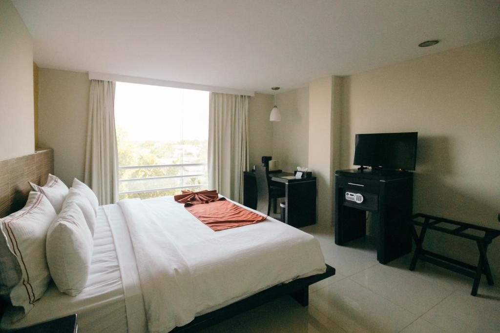 Postel nebo postele na pokoji v ubytování Hotel El Español Paseo de Montejo
