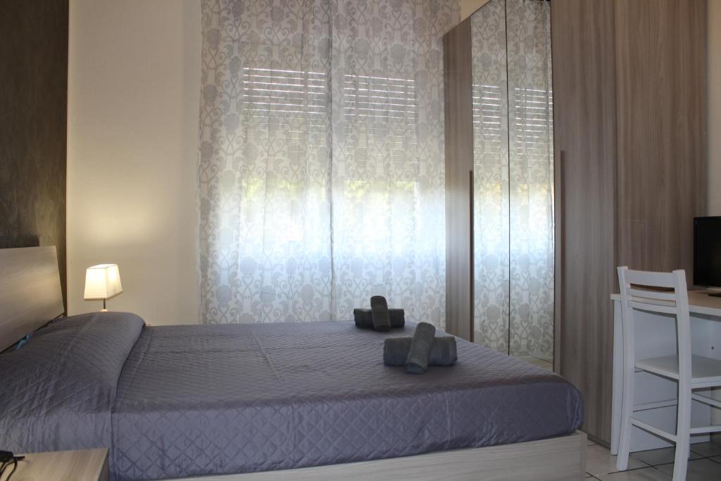A bed or beds in a room at Cagliari 4u