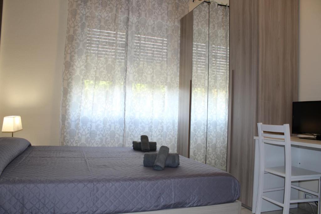 A bed or beds in a room at Cagliari 4u