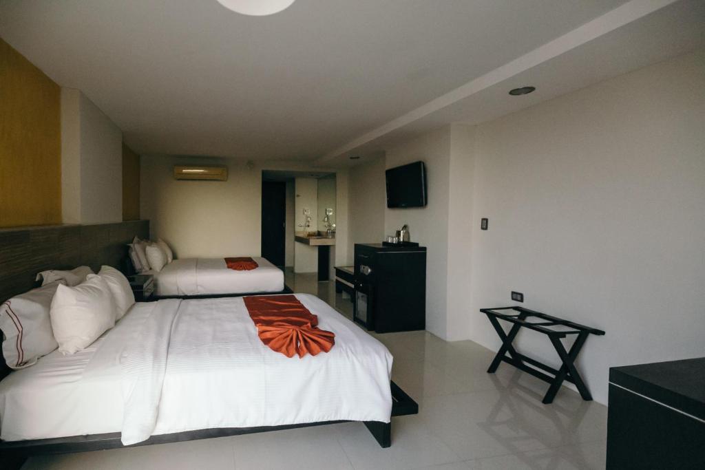 Postel nebo postele na pokoji v ubytování Hotel El Español Paseo de Montejo