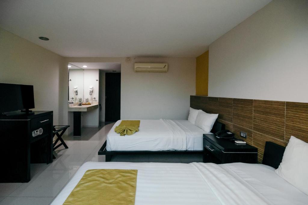Postel nebo postele na pokoji v ubytování Hotel El Español Paseo de Montejo