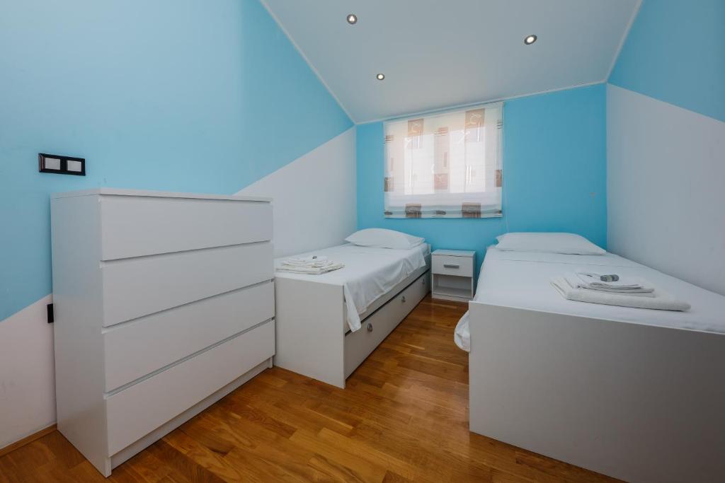 Posteľ alebo postele v izbe v ubytovaní Apartments Selak