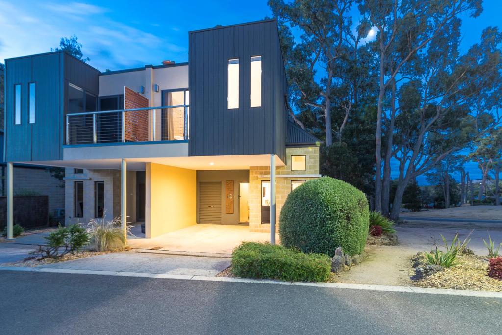 a large house with a black roof at The Sebel Creswick Forest Resort in Creswick