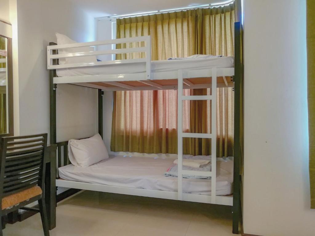 Postel nebo postele na pokoji v ubytování K.M. House
