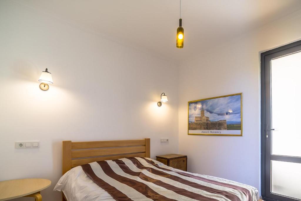 Postel nebo postele na pokoji v ubytování Chateau Napareuli