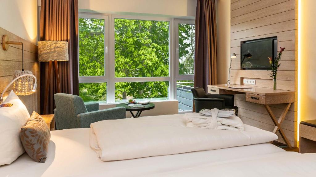 Postel nebo postele na pokoji v ubytování Hotel Der Seehof
