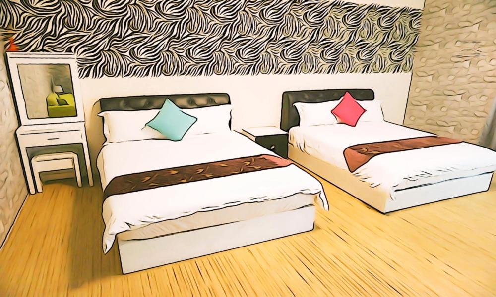 東港的住宿－東港海灣精品民宿  ，卧室的一张图,带两张床