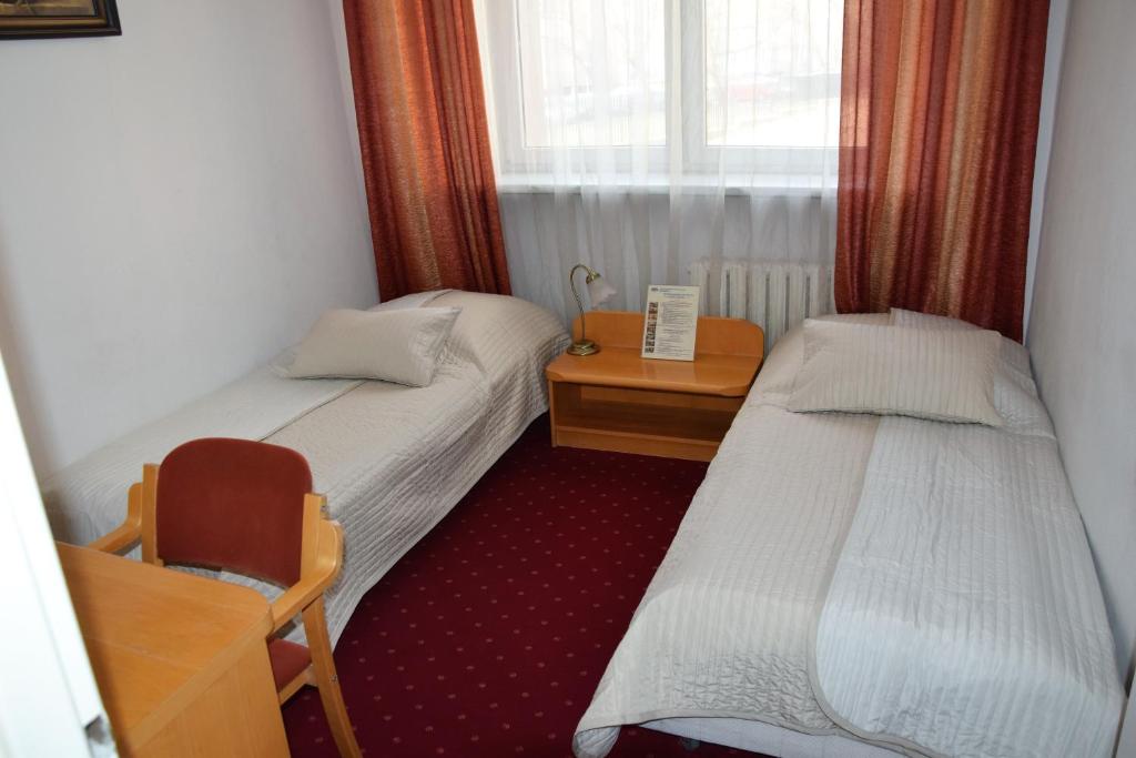 Posteľ alebo postele v izbe v ubytovaní Centrum Konferencyjne IBIB PAN