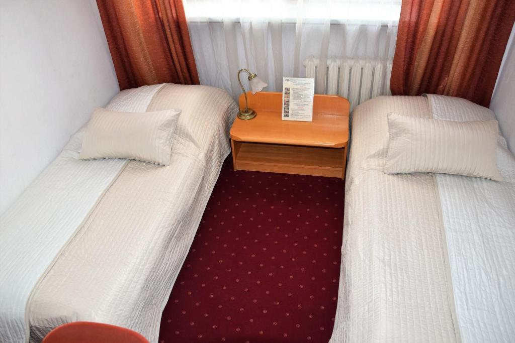 Posteľ alebo postele v izbe v ubytovaní Centrum Konferencyjne IBIB PAN