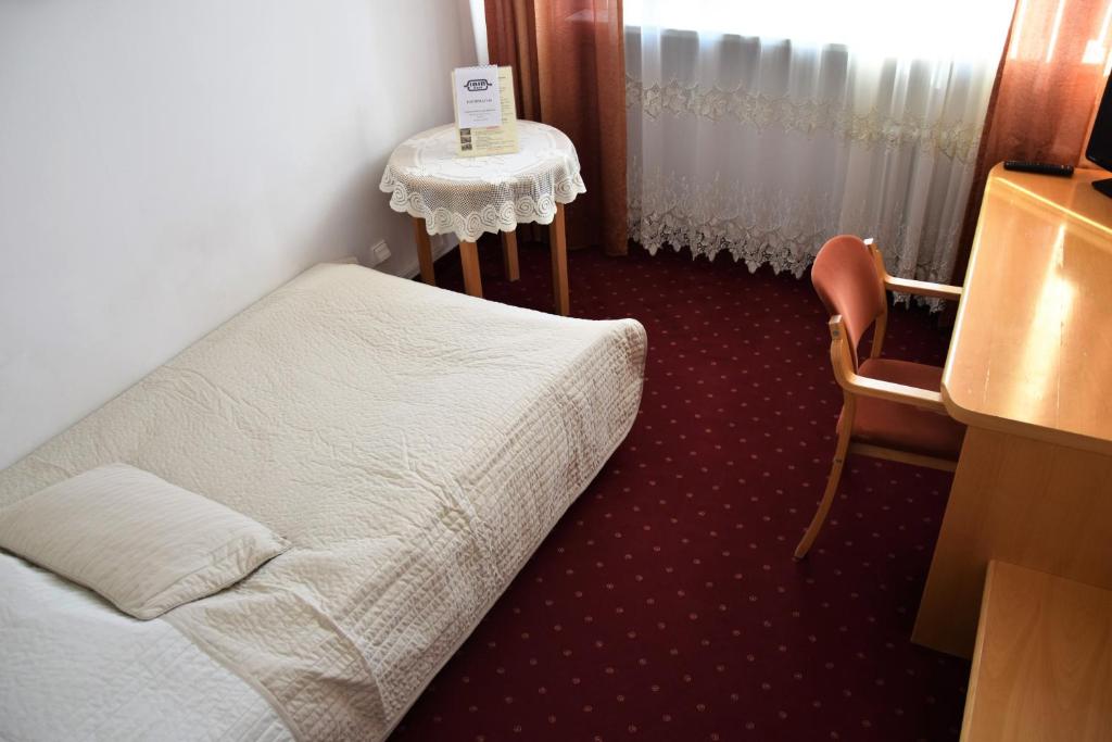 Posteľ alebo postele v izbe v ubytovaní Centrum Konferencyjne IBIB PAN