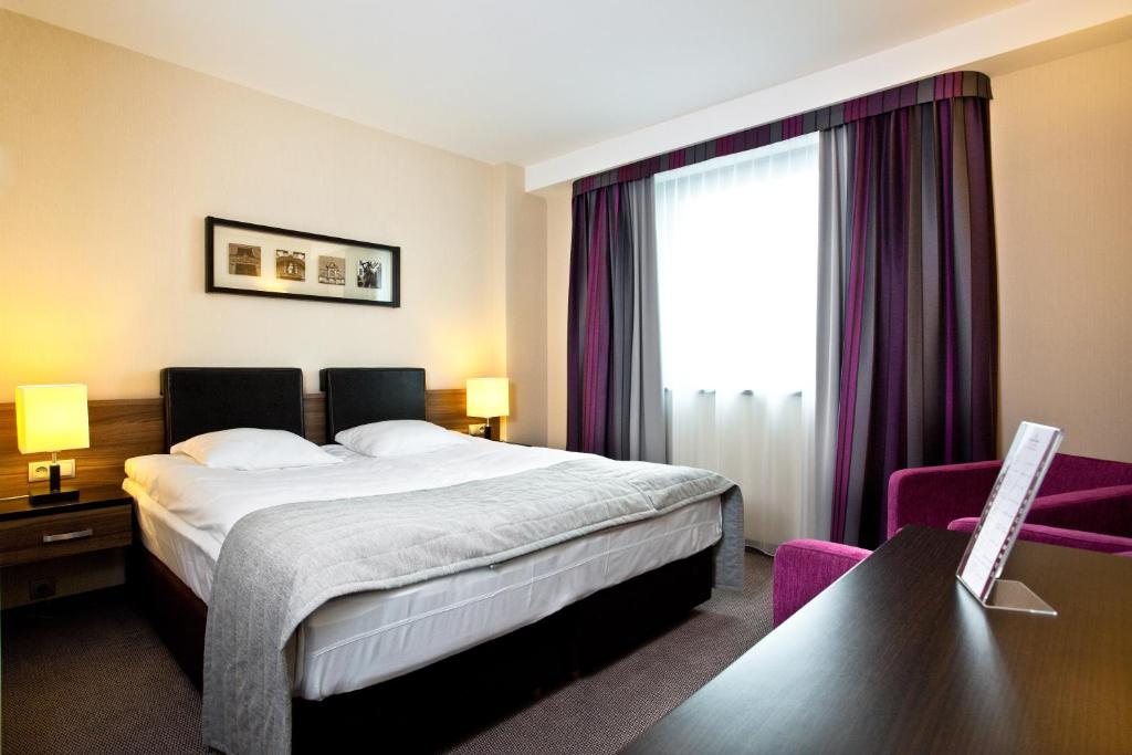 Postel nebo postele na pokoji v ubytování Qubus Hotel Bielsko-Biała