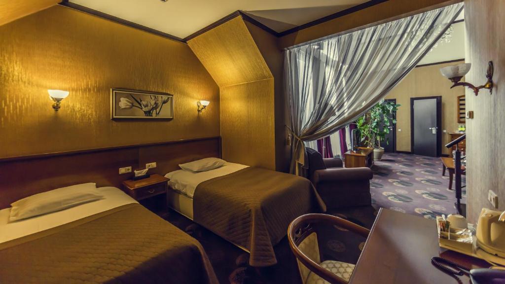 Postel nebo postele na pokoji v ubytování Park-Hotel Golosievo