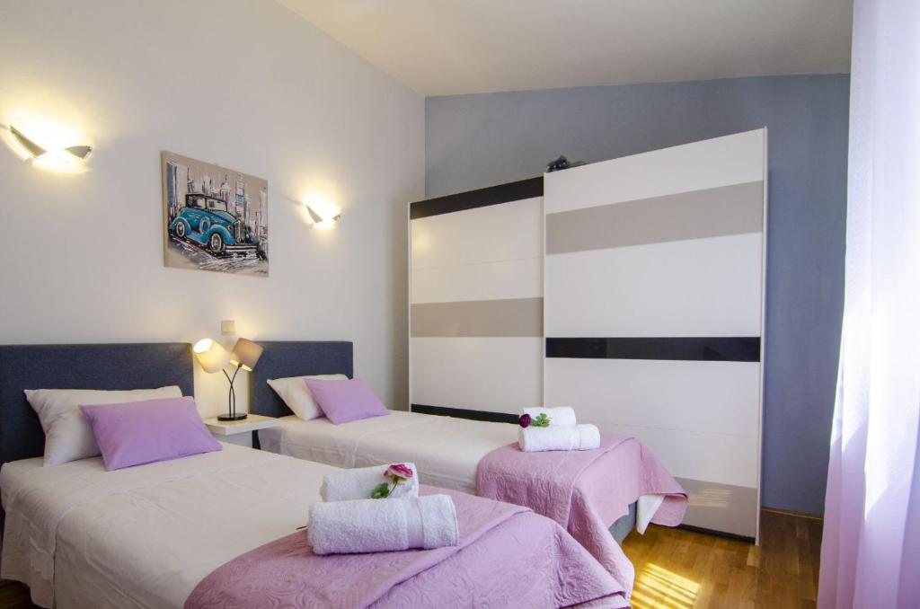 Postel nebo postele na pokoji v ubytování Villa Katja