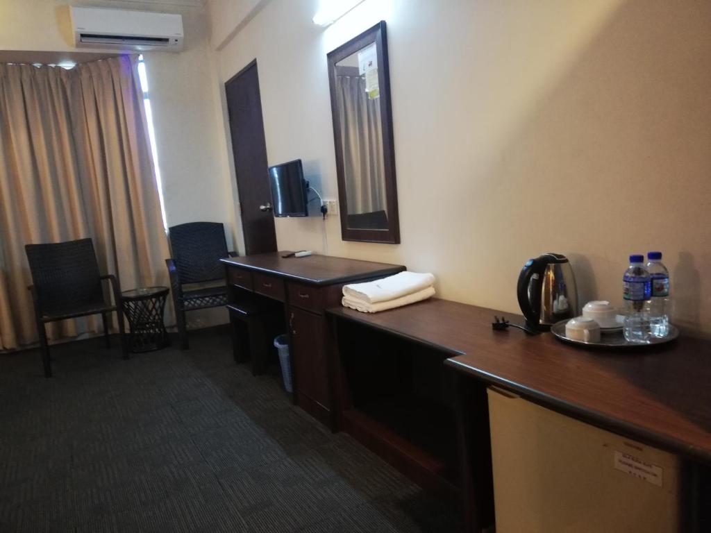 TV a/nebo společenská místnost v ubytování Hotel Damai