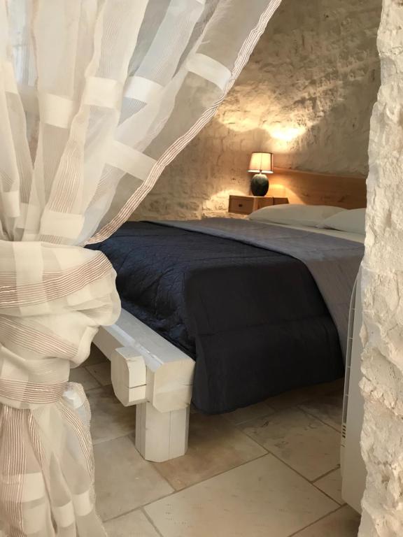 Postel nebo postele na pokoji v ubytování Borgo D'Itria