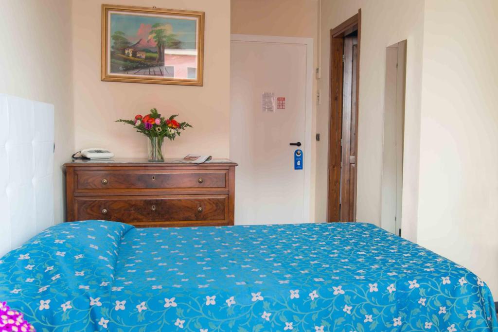 Łóżko lub łóżka w pokoju w obiekcie Hotel Elisabetta