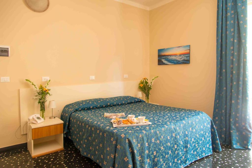 Łóżko lub łóżka w pokoju w obiekcie Hotel Elisabetta