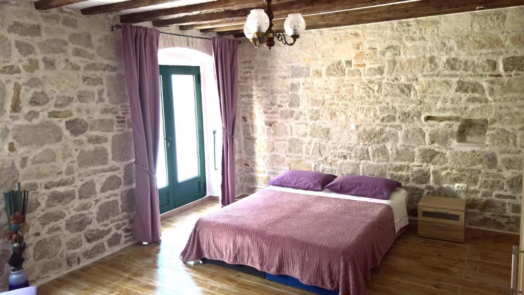 Postel nebo postele na pokoji v ubytování Apartment Franicevic
