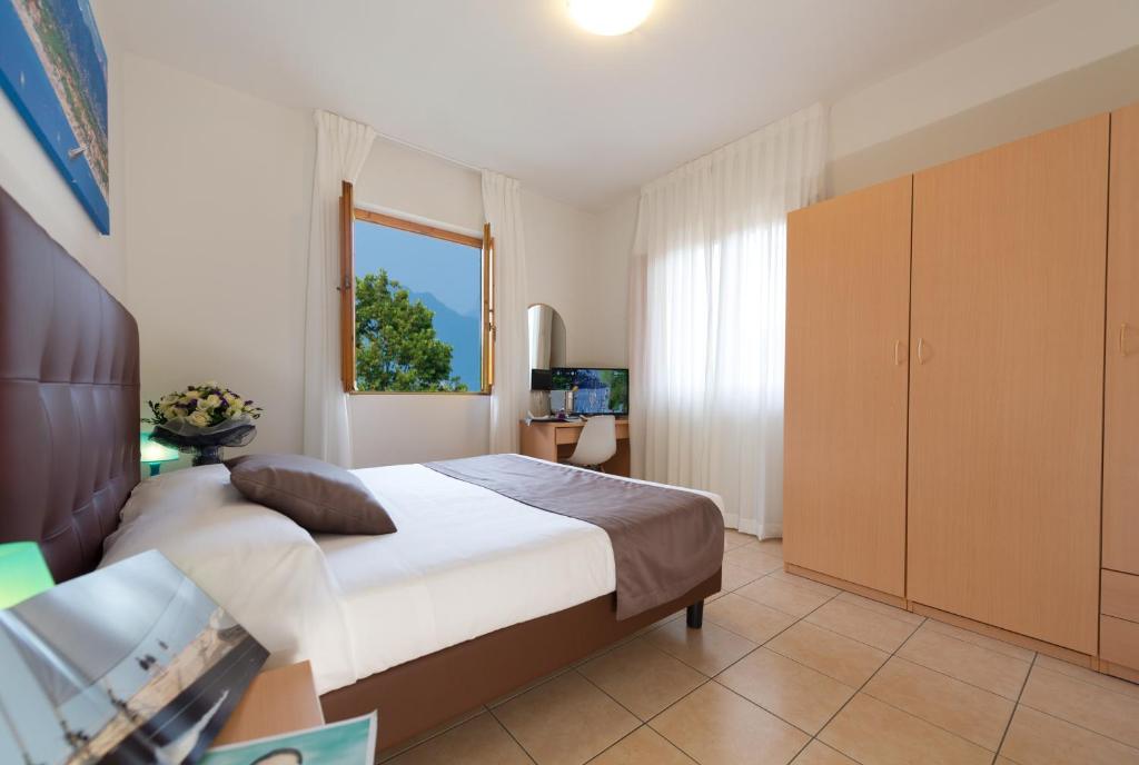 Postel nebo postele na pokoji v ubytování Hotel La Pace