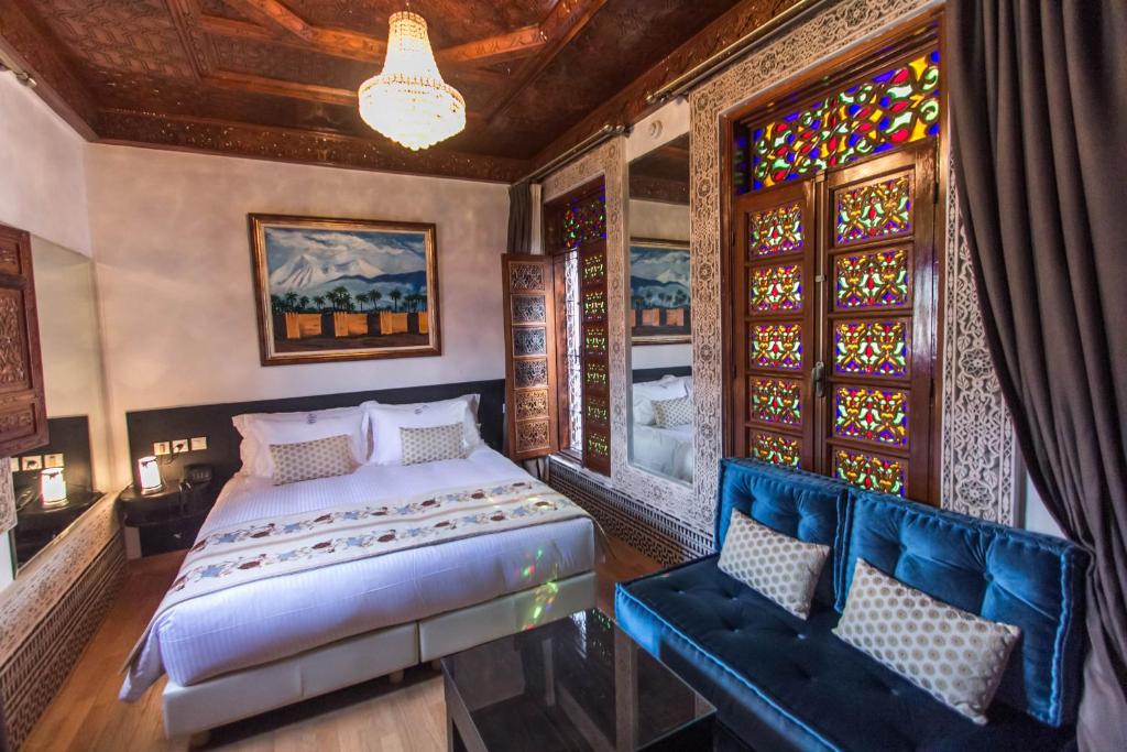 Postel nebo postele na pokoji v ubytování Riad Fes Andalucia
