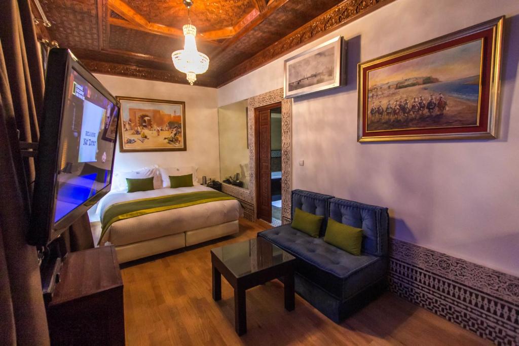 Postel nebo postele na pokoji v ubytování Riad Fes Andalucia