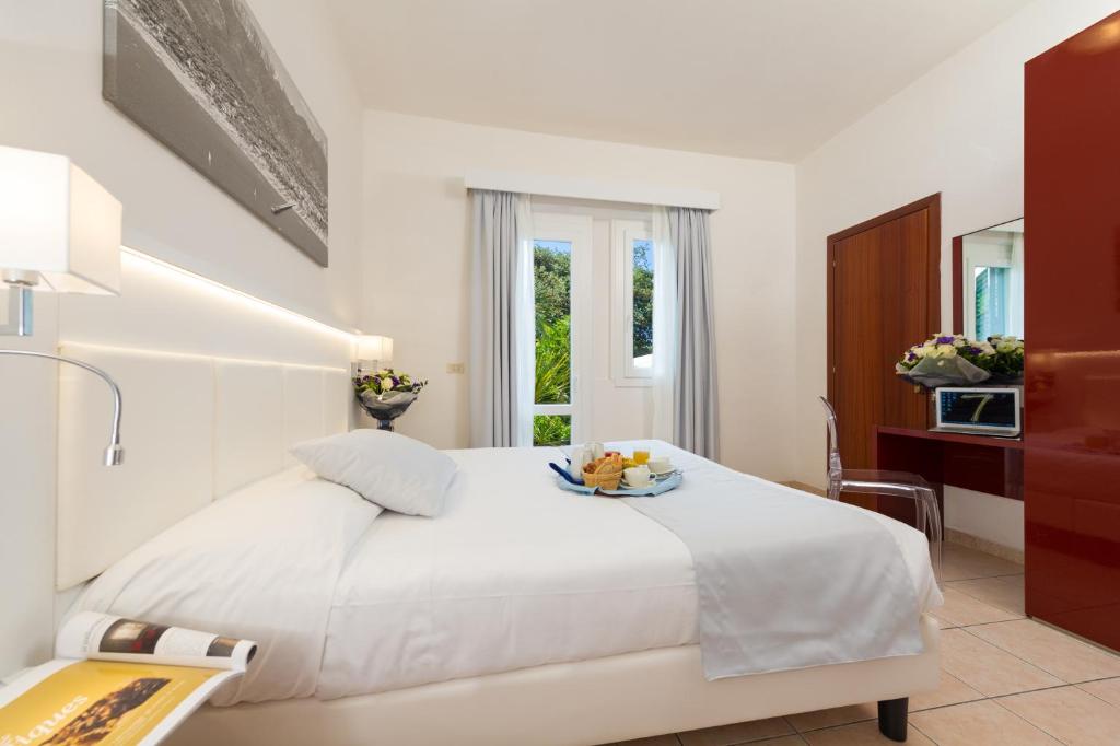 Postel nebo postele na pokoji v ubytování Hotel La Pace