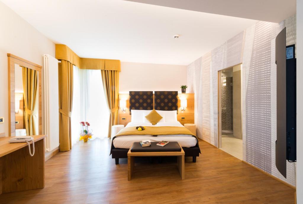 Postel nebo postele na pokoji v ubytování Hotel Ambassador
