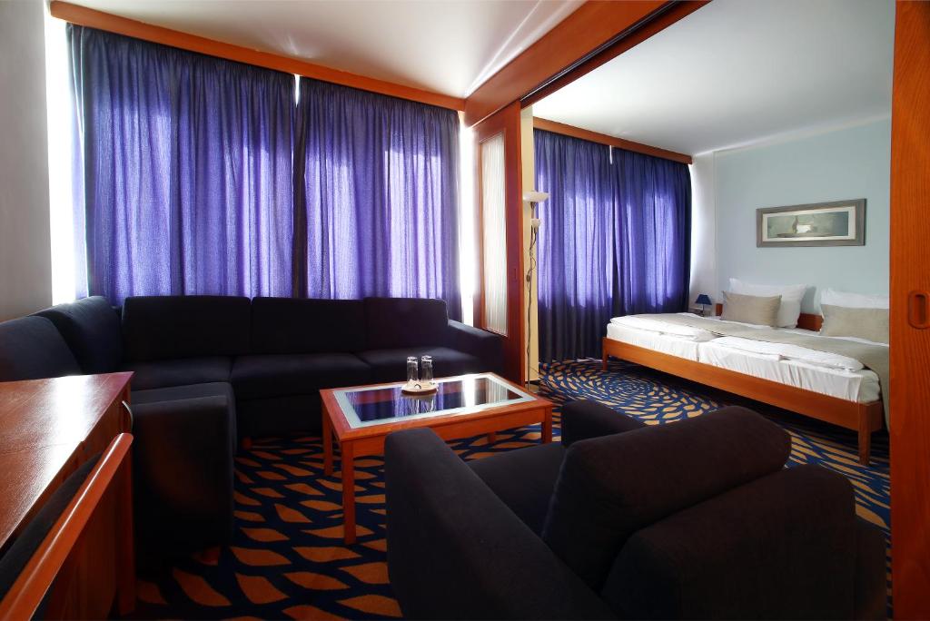 Postel nebo postele na pokoji v ubytování Hotel Central