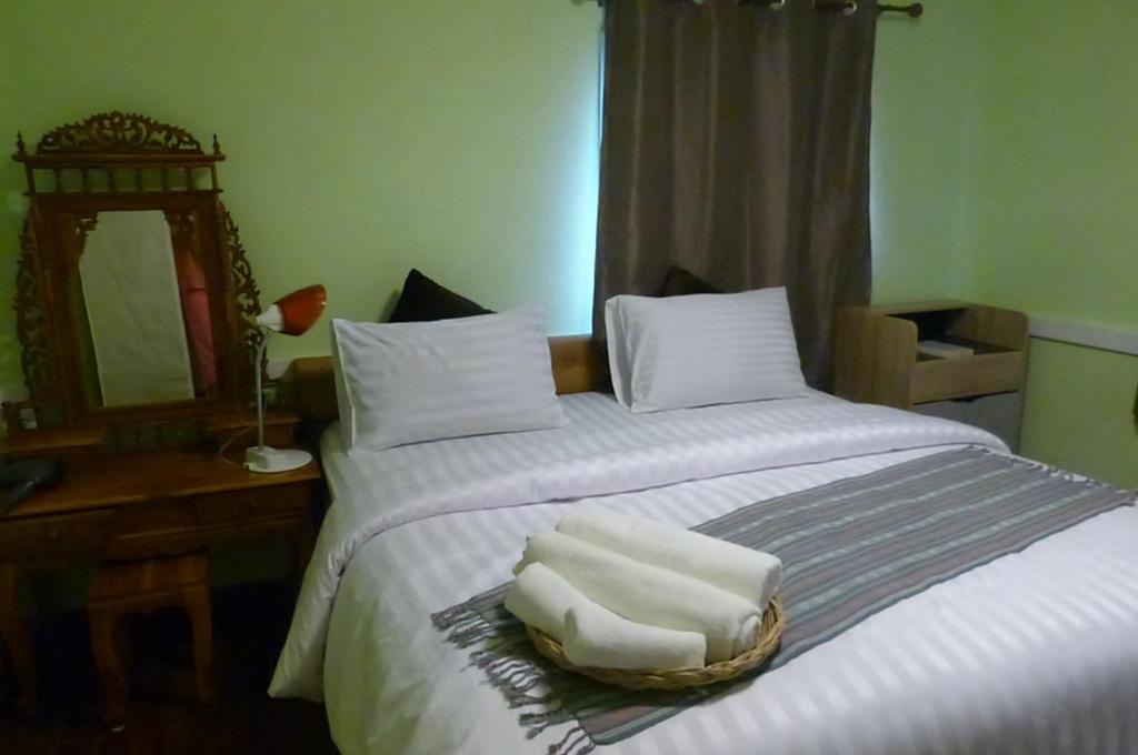 Postel nebo postele na pokoji v ubytování Boons Bungalow Ban Krut